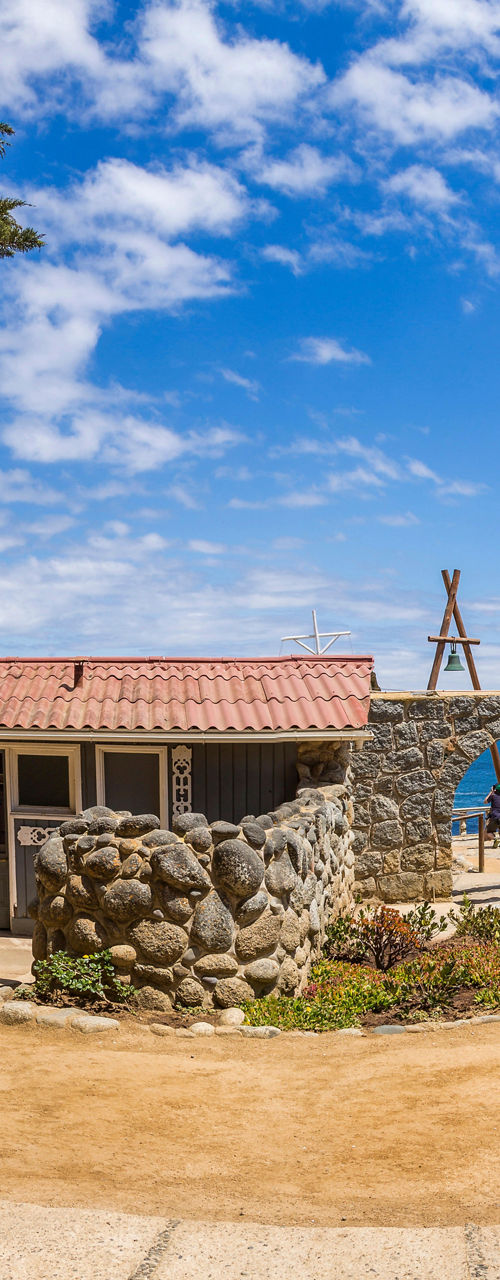Rustic stone courtyard under blue sky