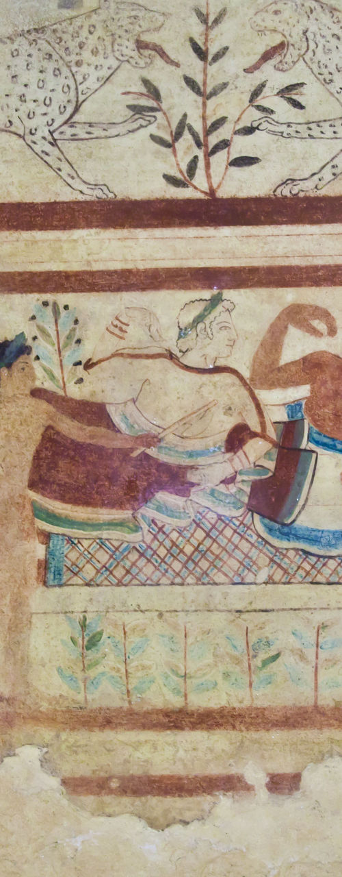 Ancient fresco of banquet scene with leopards