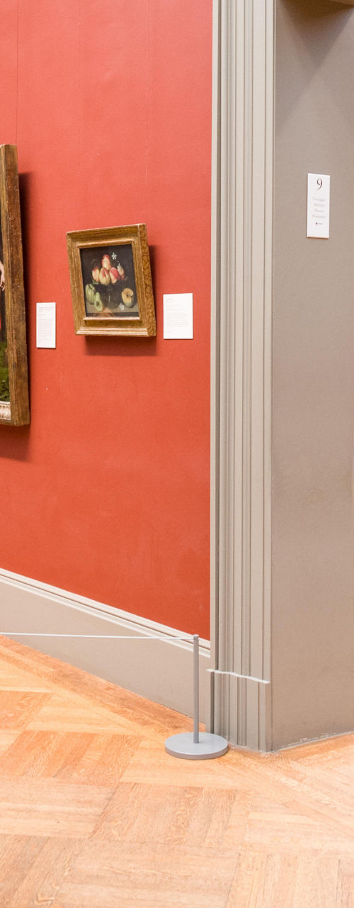 Art gallery with visitors and paintings