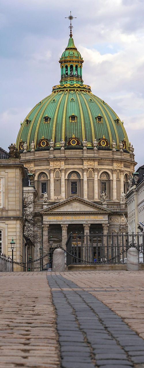 Historic square with statue and dome