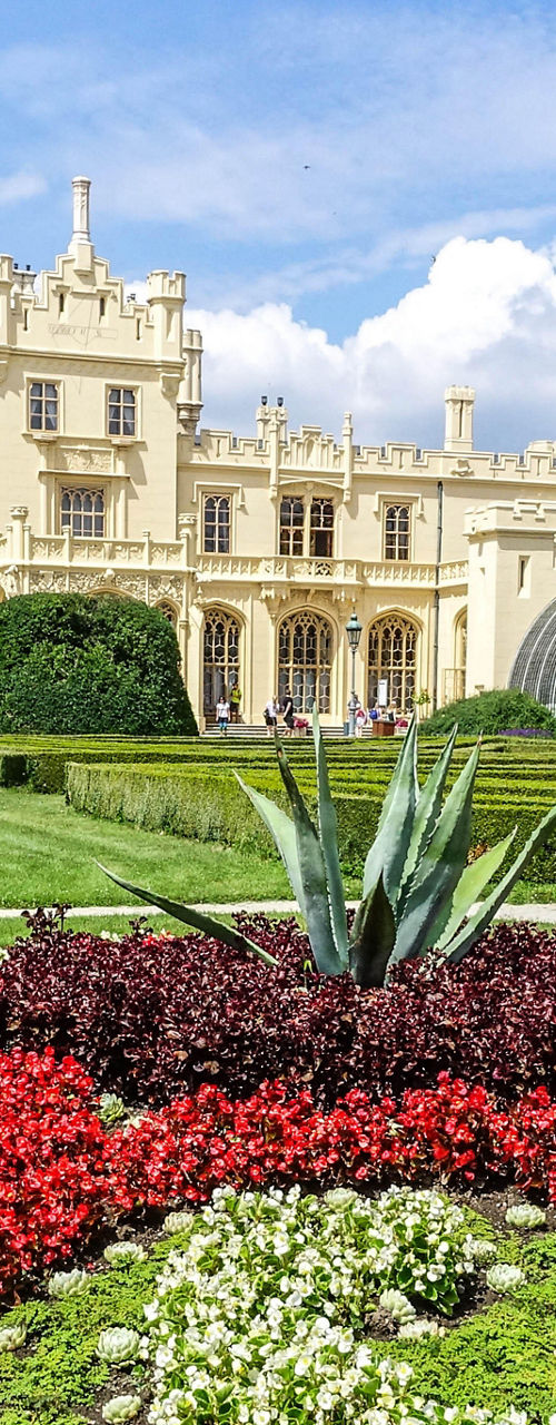 Historic castle with vibrant garden display