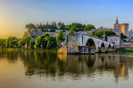 Historic bridge and palace at sunset