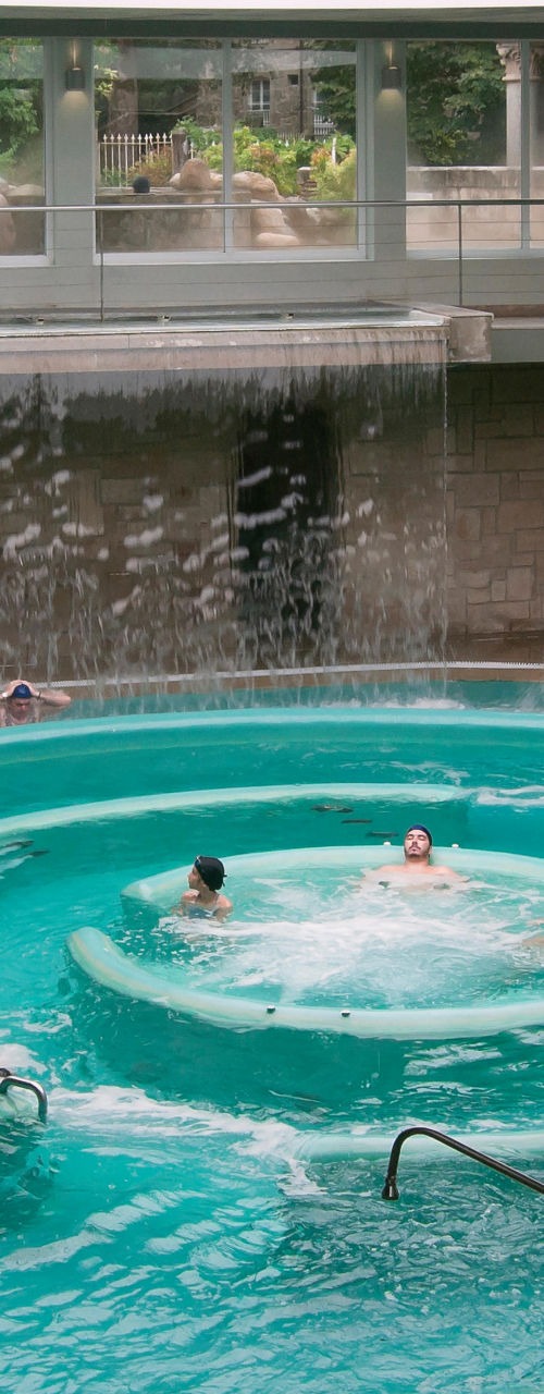 Indoor spa pool with waterfall feature