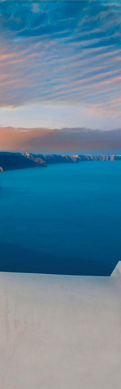Santorini sunset with iconic blue domes