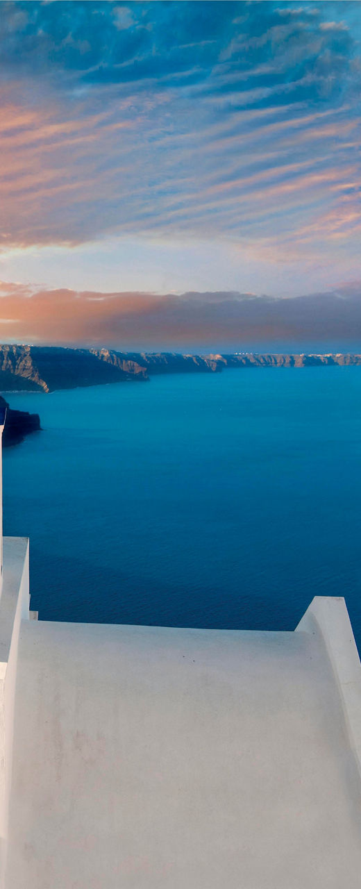 Santorini sunset with iconic blue domes