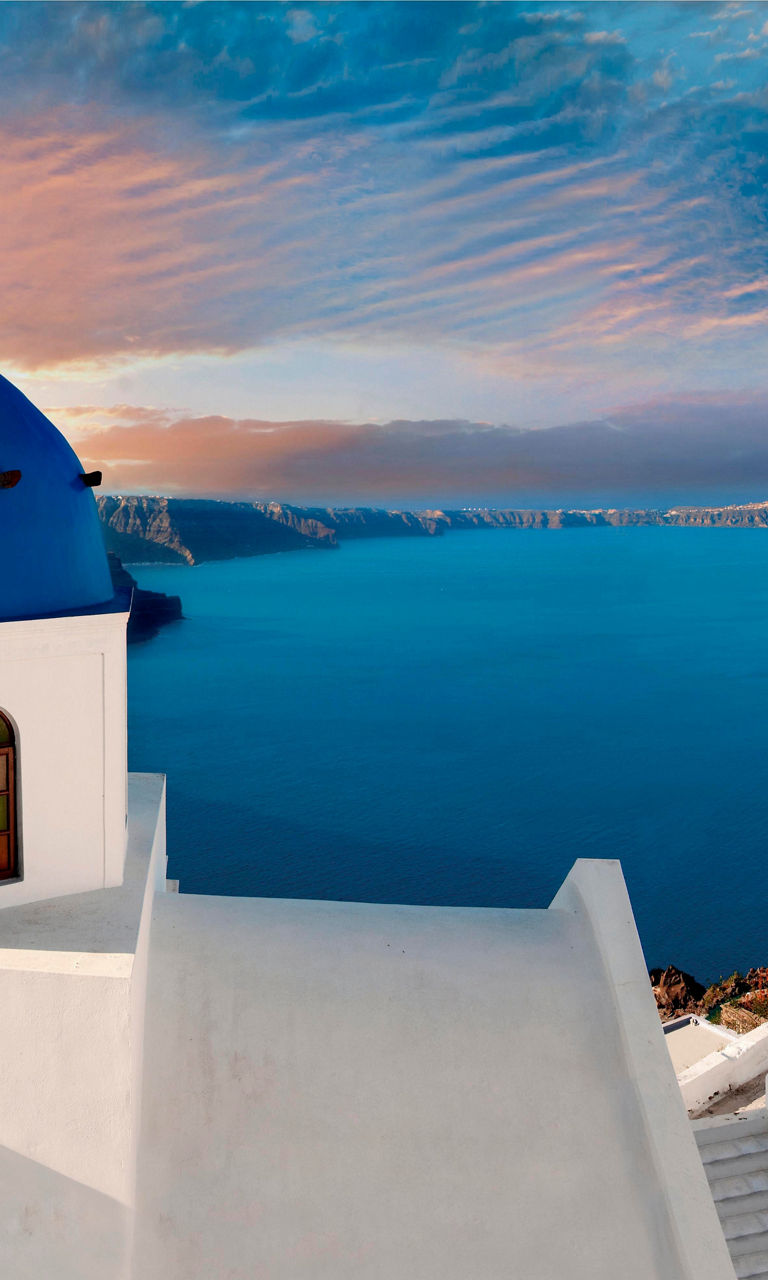 Santorini sunset with iconic blue domes