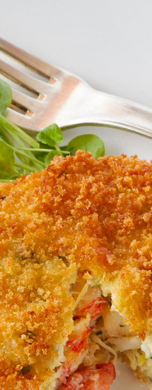 Crispy seafood cake with fresh greens