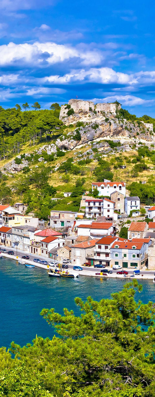 Scenic coastal town with historic fortress