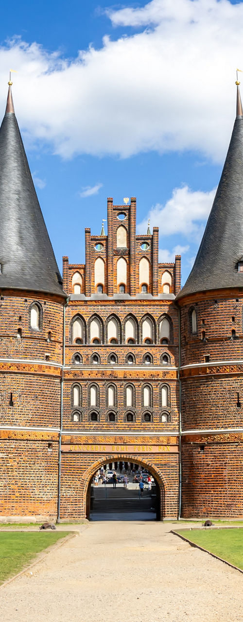 Historic brick city gate in sunny park