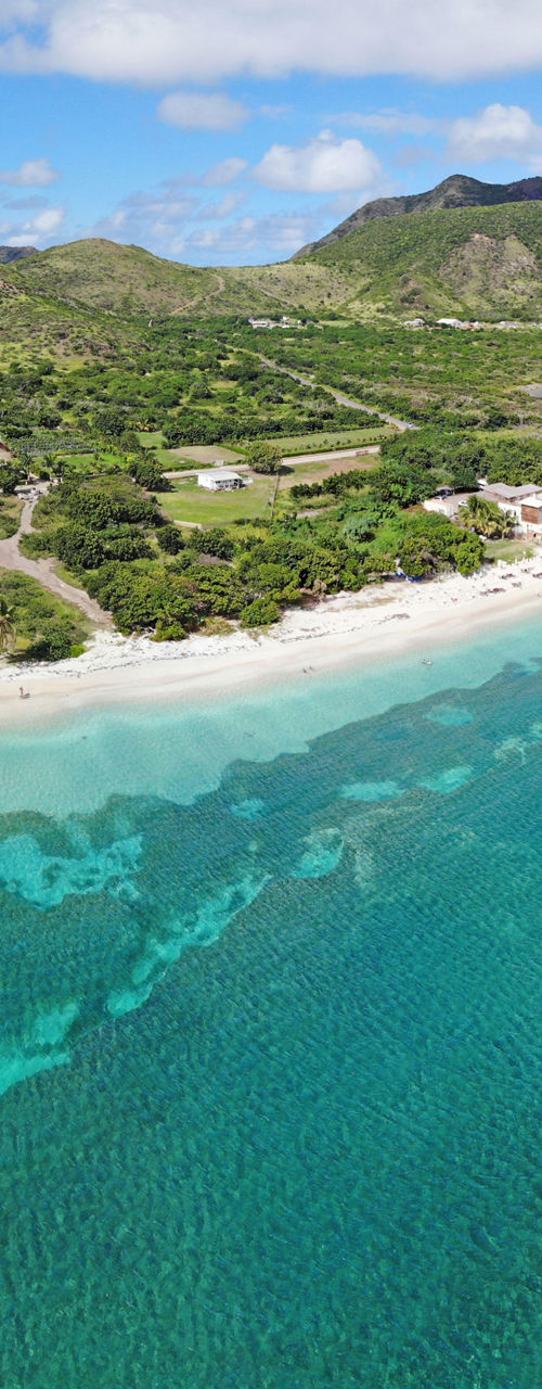 Aerial view of tropical coastline and mountains