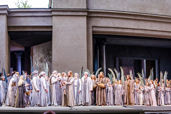 Large Ensemble Cast Performing on Outdoor Stage
