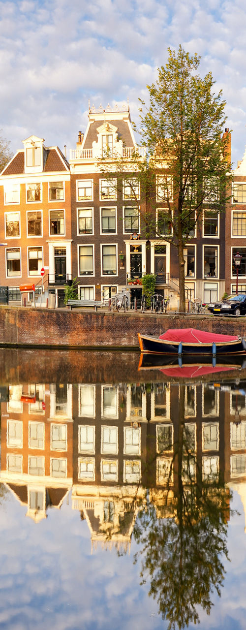 Scenic Amsterdam canal with reflections
