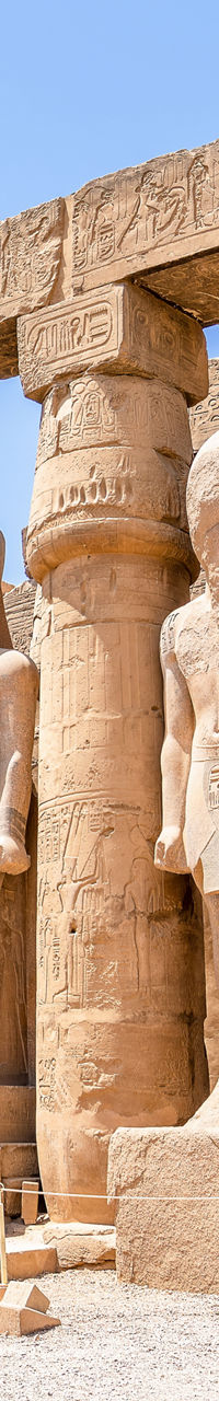Ancient Egyptian temple with statues and columns