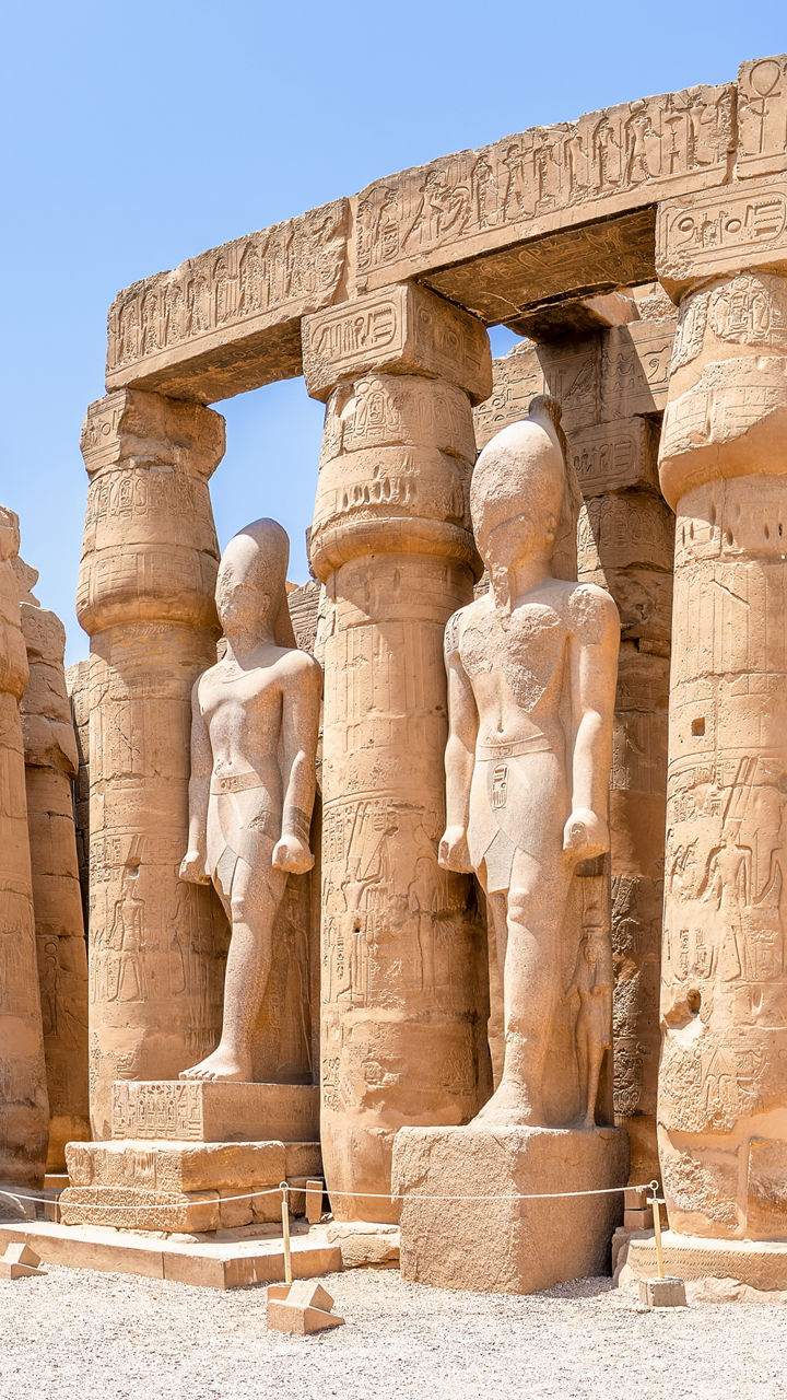 Ancient Egyptian temple with statues and columns