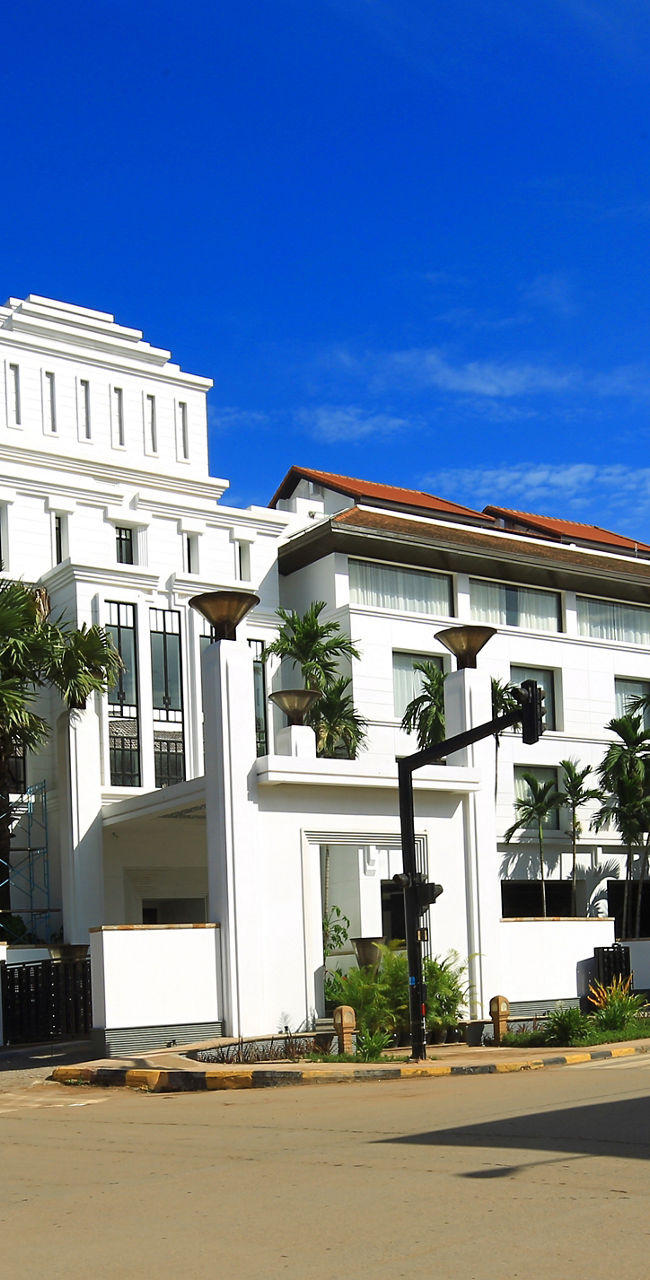 Colonial-style white building on sunny street