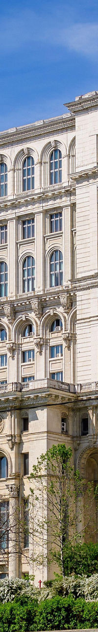 Grand architectural building with lush greenery