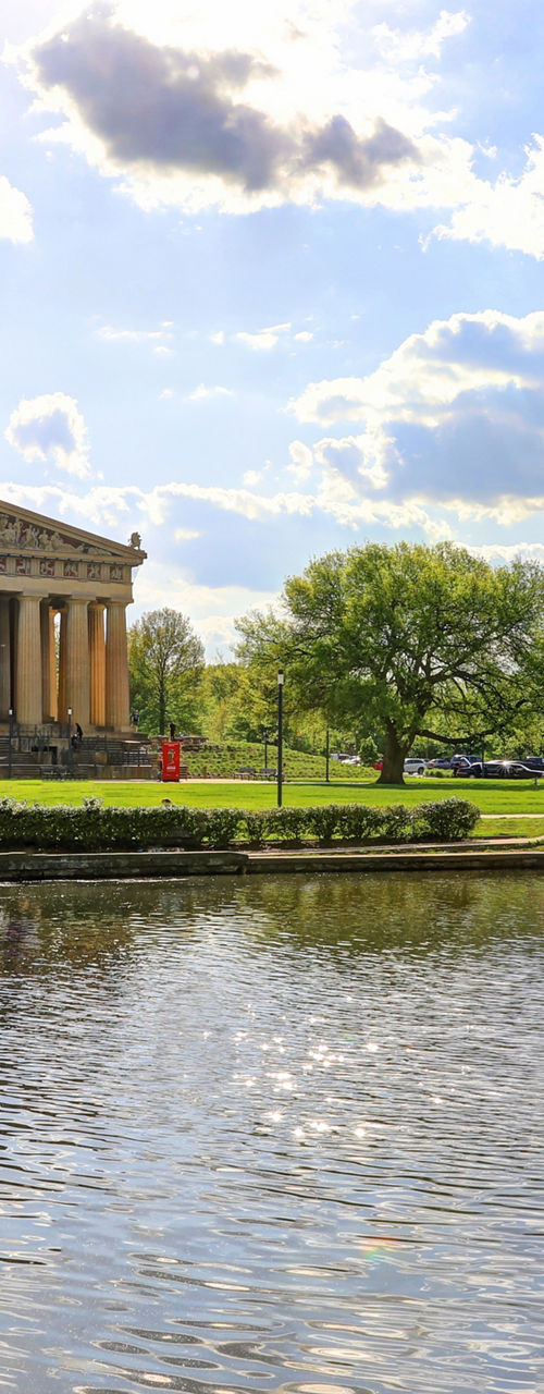 Historic Parthenon replica in sunny park setting