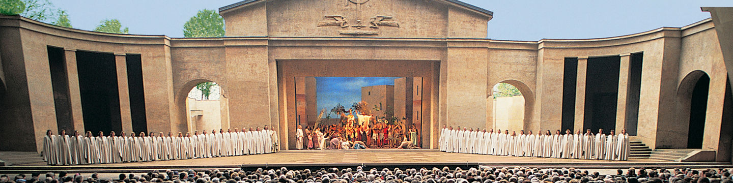 Outdoor theater performance with large audience
