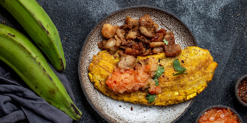 Fried plantain with pork and salsa