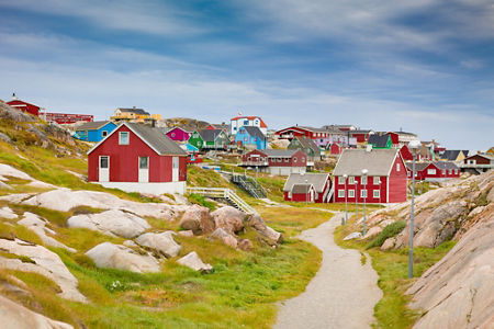 Colorful coastal village with red houses