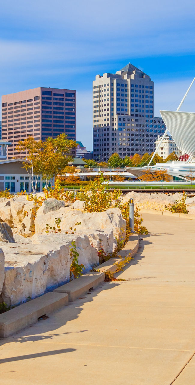 Milwaukee cityscape with waterfront pathway