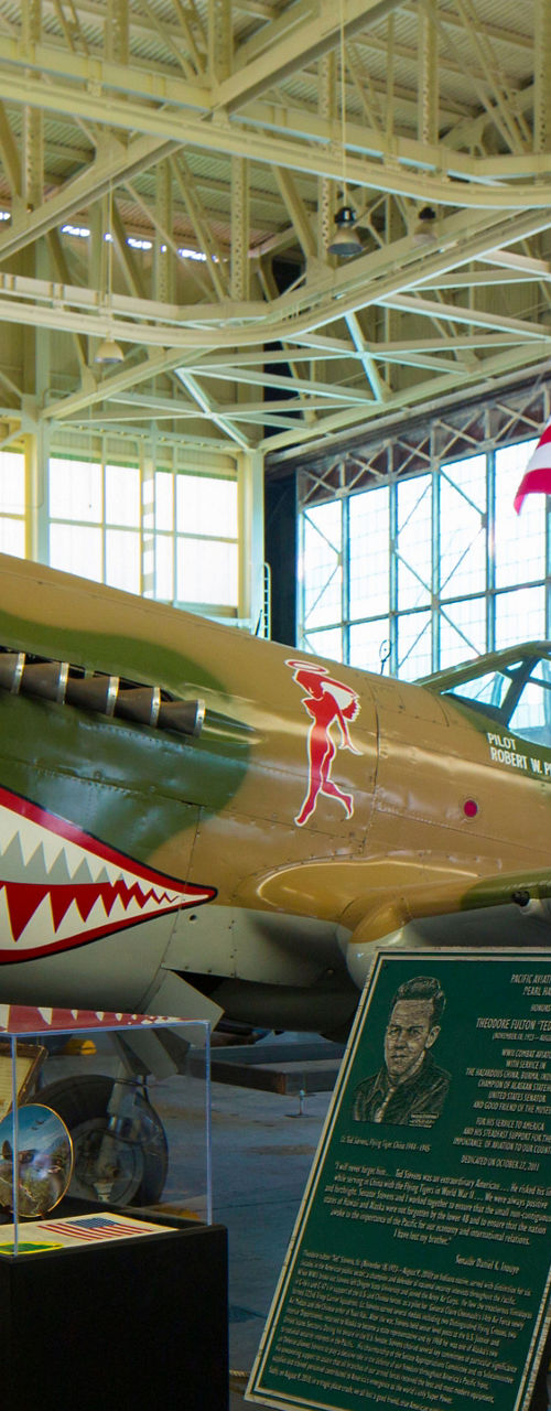 Vintage fighter plane in museum hangar