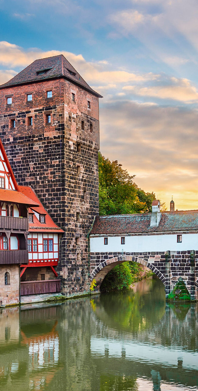 Historic riverside architecture at sunset