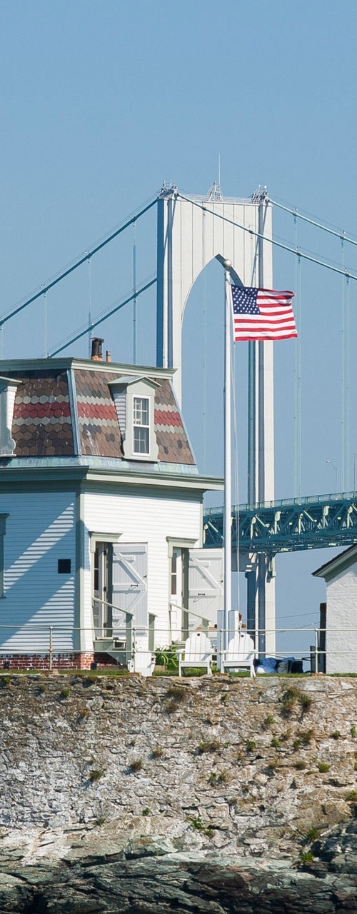 Historic lighthouse near suspension bridge