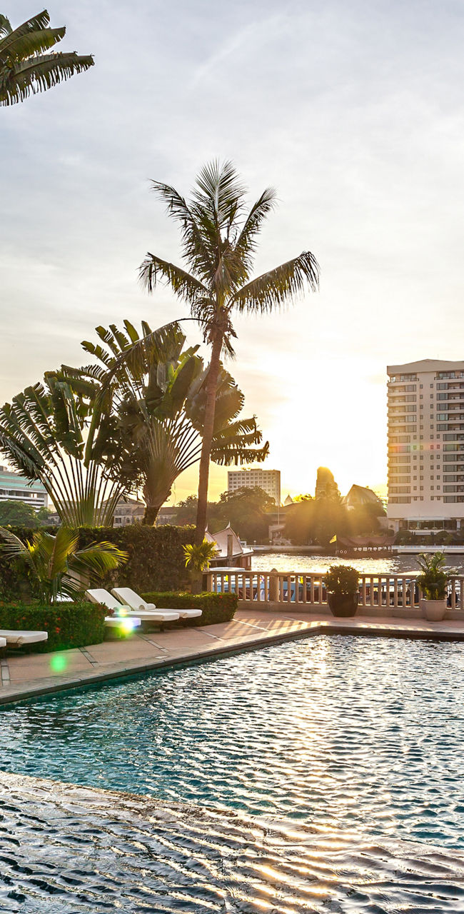 Luxury poolside with city skyline view