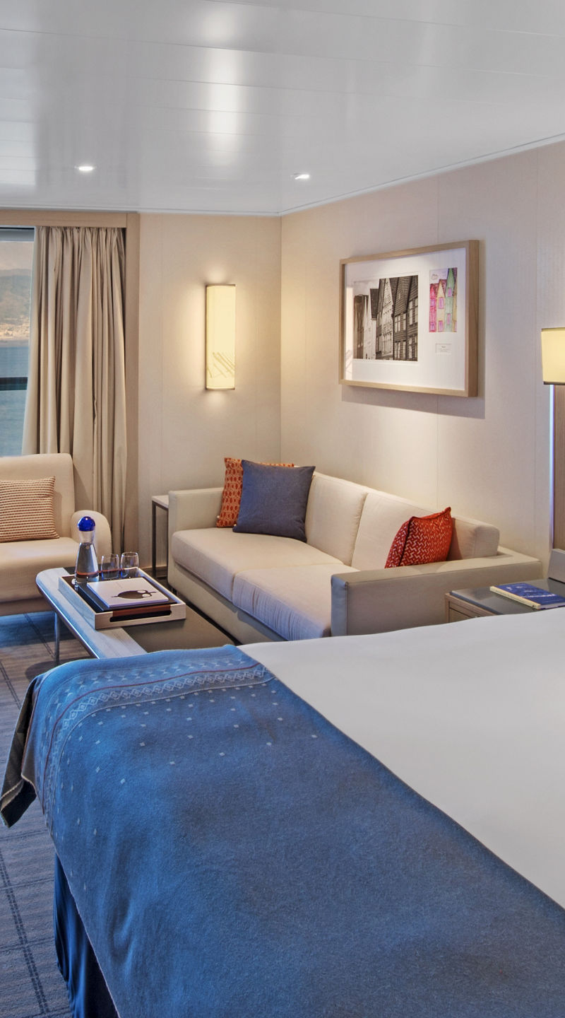 Modern cruise ship cabin with ocean view