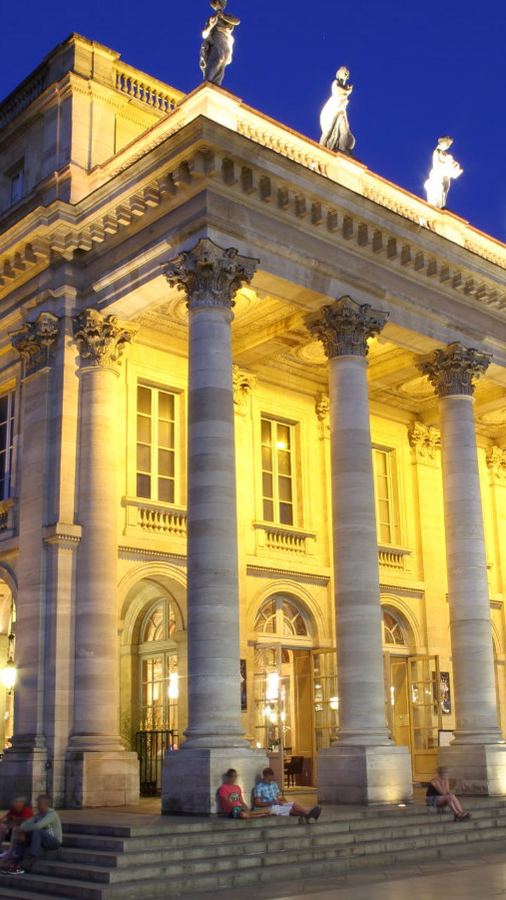 Illuminated Grand Theater at Night