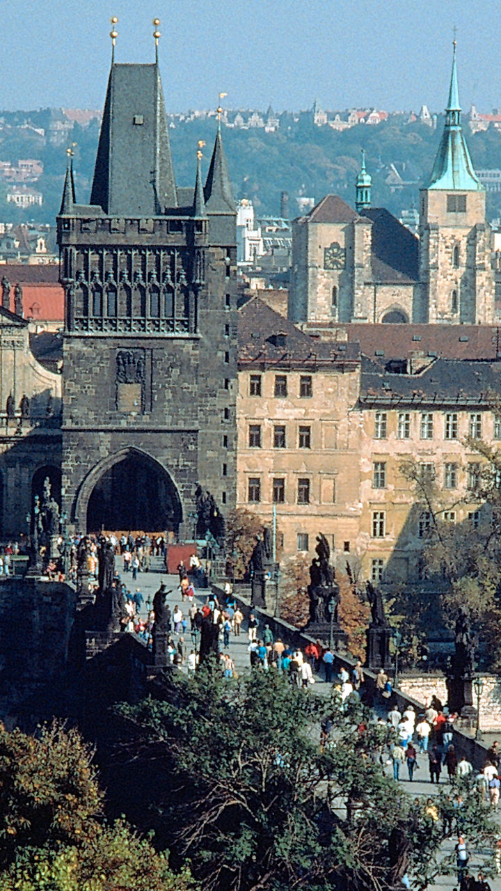 Charles Bridge in Prague with bustling crowd