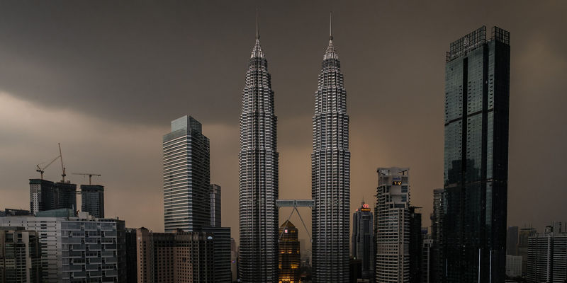 Petronas Towers skyline at dusk in Kuala Lumpur