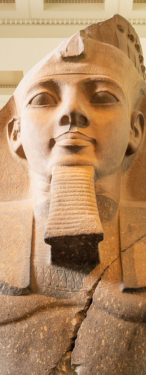 Ancient Egyptian statue in museum setting