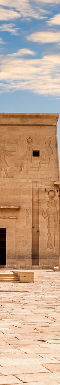 Ancient Egyptian temple courtyard under clouds