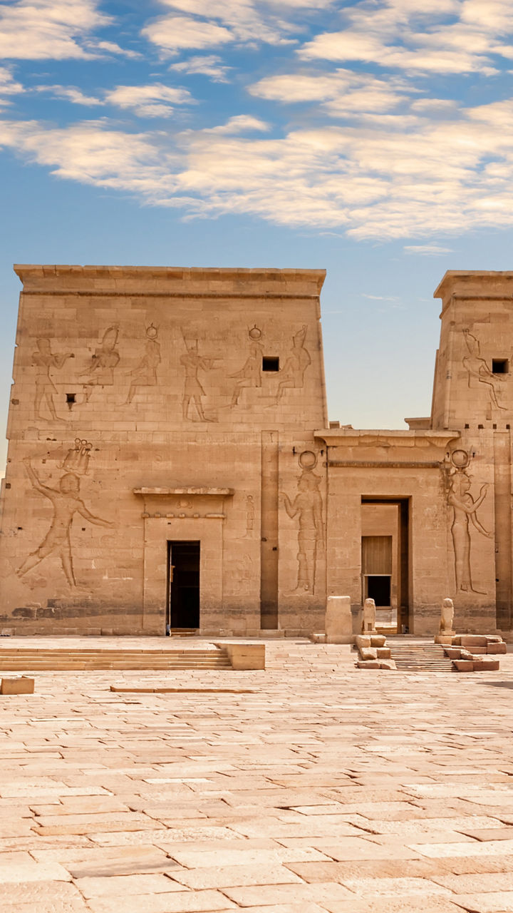 Ancient Egyptian temple courtyard under clouds