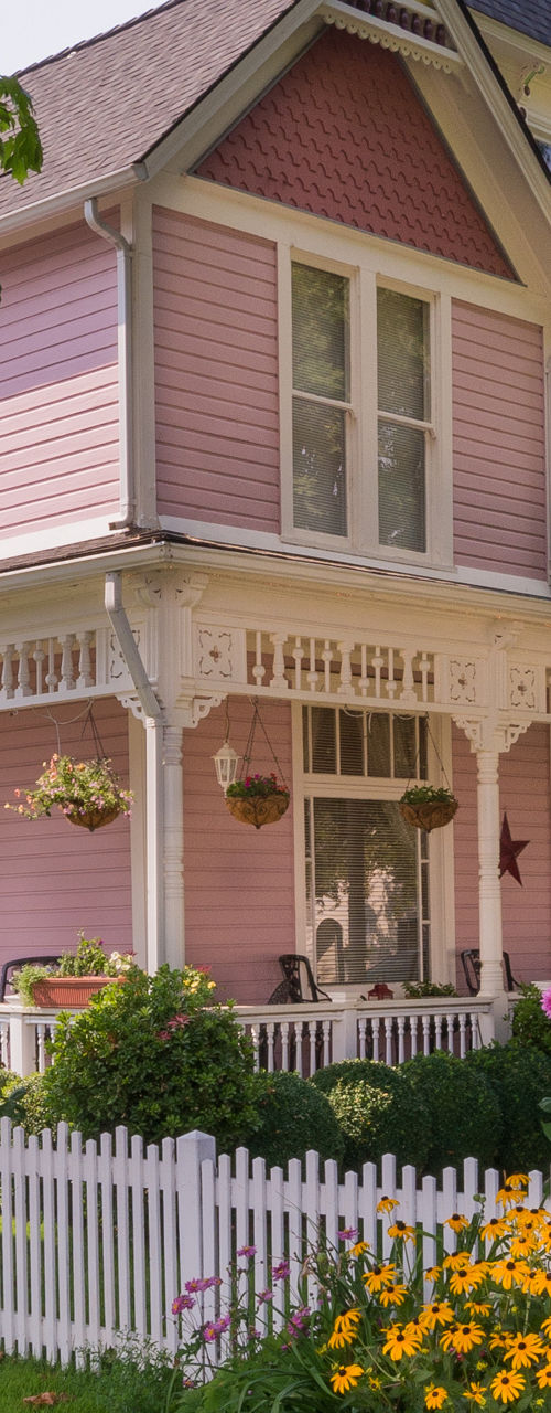Charming Pink Victorian House with Garden Fence
