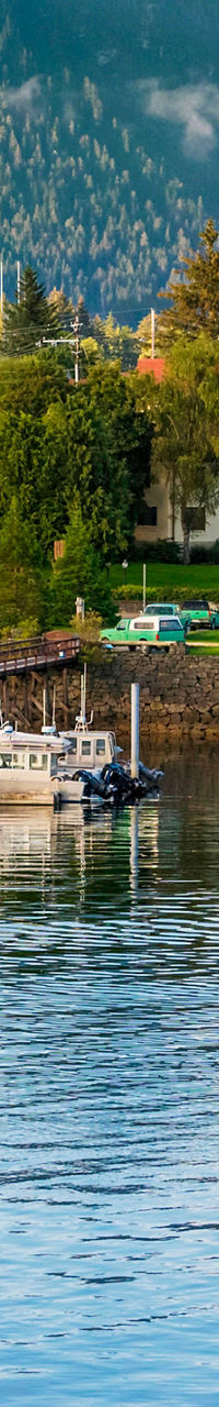 Scenic harbor town with mountain backdrop