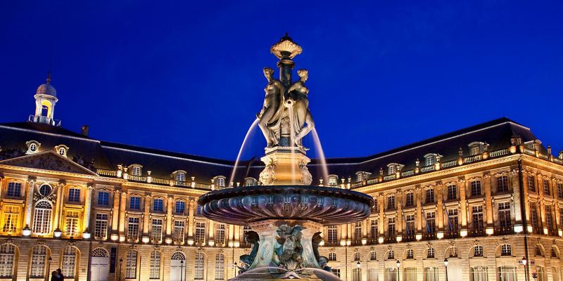 Illuminated fountain at Place de la Bourse