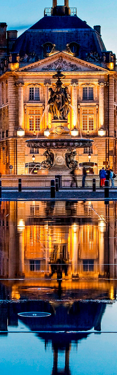 Historic Bordeaux buildings at sunset reflection