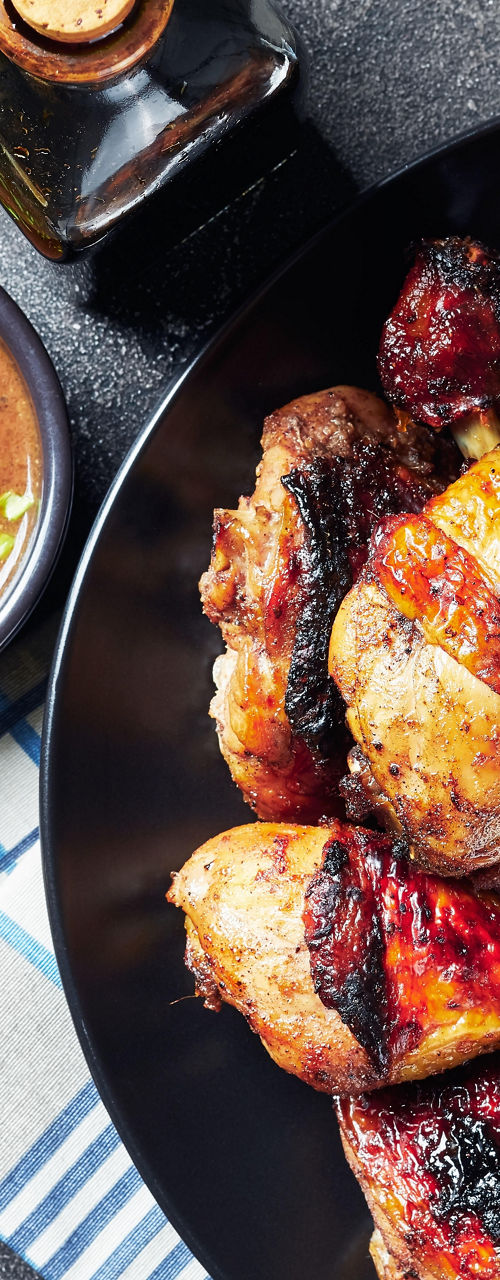 Grilled chicken drumsticks with spices and sauce