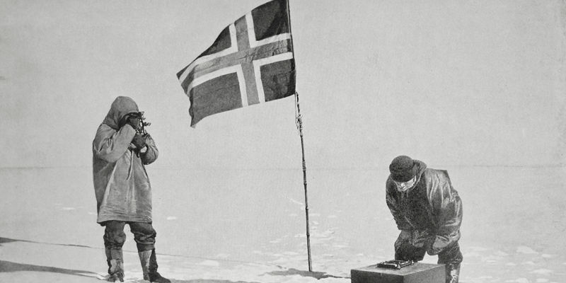 Explorers at the South Pole with Norwegian Flag