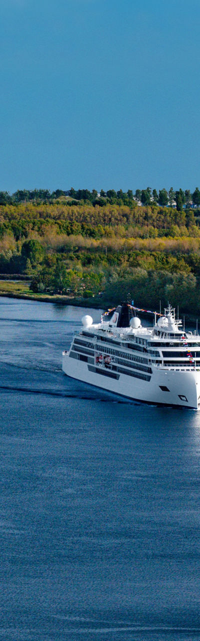 Cruise ships sailing on scenic river