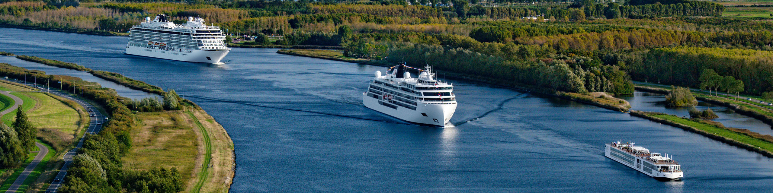 Cruise ships sailing on scenic river