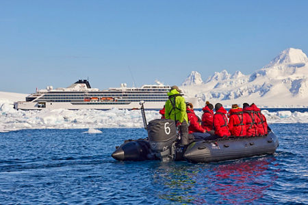 Tourists explore icy waters near cruise ship