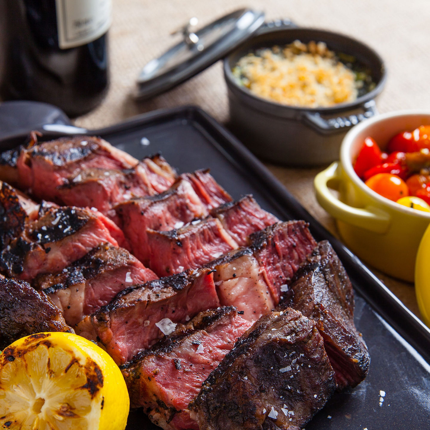 Grilled steak with vegetables and wine