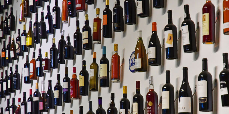Wall display of assorted wine bottles