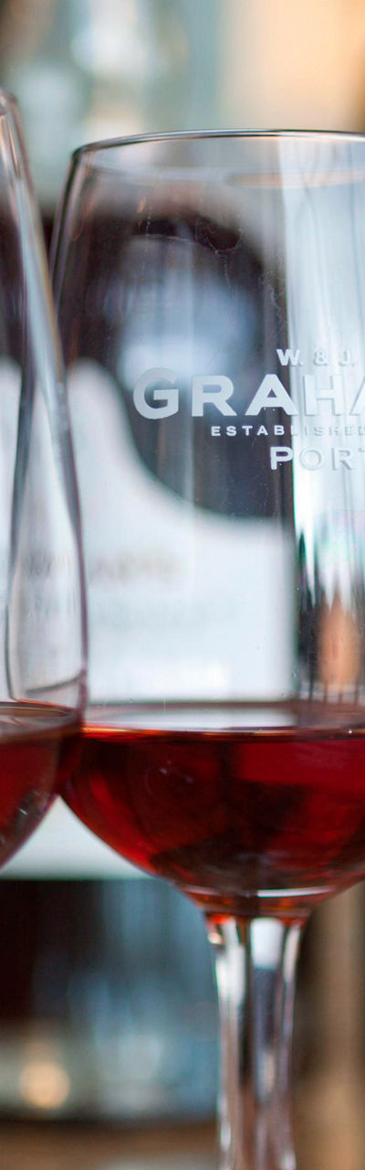 Three wine glasses with red wine on table