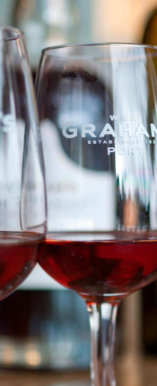 Three wine glasses with red wine on table