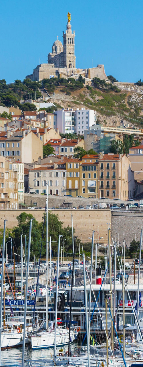 Scenic marina with hillside cityscape
